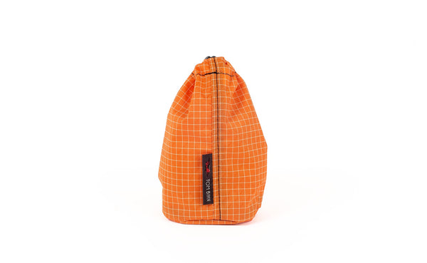 A Size 1 Zest (pale orange with white grid) 200 Halcyon Travel Stuff Sack.